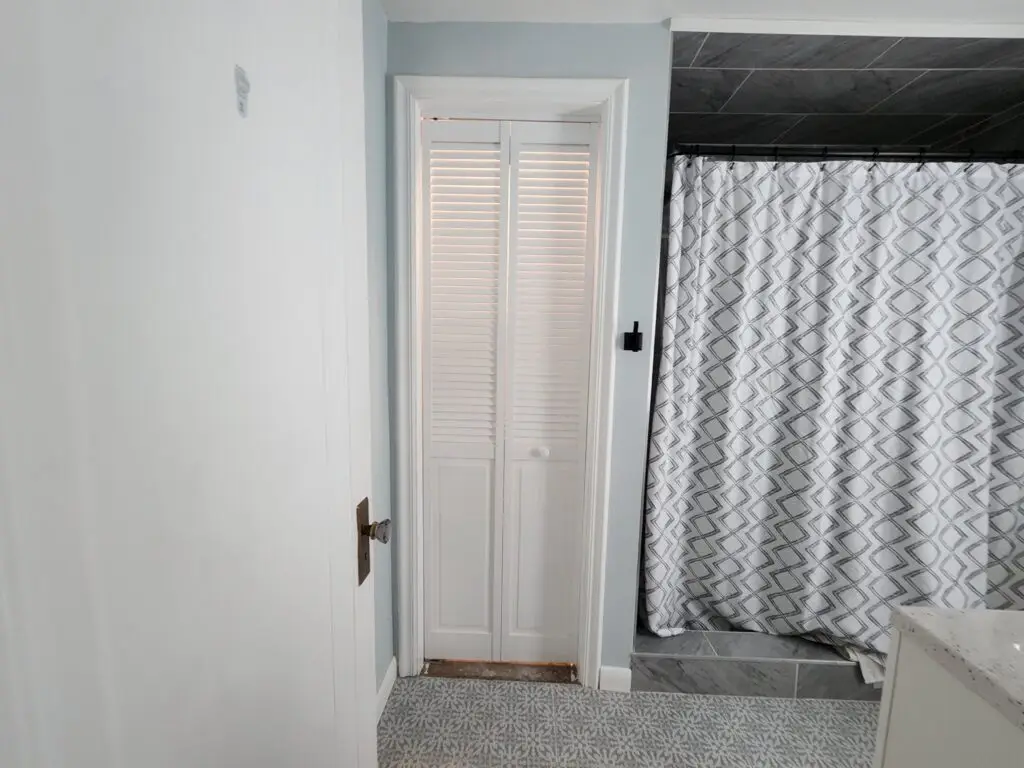 Bathroom Linen Closet Renovation in Wyandotte — bifold door installation